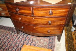 A 19th Century mahogany bow fronted chest of two short over two long drawers to splayed feet