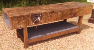 A pine top workbench with integral vice,