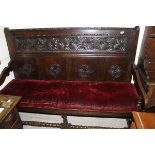 An oak settle in the 17th Century manner,