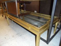 A brass and glass rectangular coffee table, a mahogany framed rectangular side table,