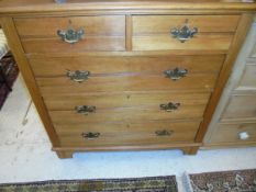 An Edwardian satin walnut chest of two short above three long drawers to bracket feet