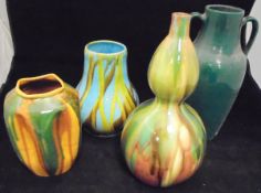 A collection of various Continental pottery vases and two similar ewers