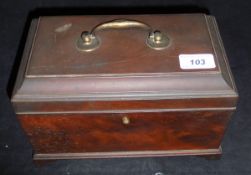 A George III mahogany tea caddy with brass swan-neck handle opening to reveal a three section