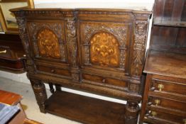 A 20th Century oak cupboard in the 17th Century manner,