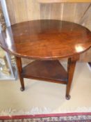 A oak cricket table together with a 19th Century oak panel seated elbow chair and an Edwardian