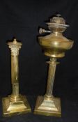 A brass table lamp base in the form of a Corinthium column on a stepped base,