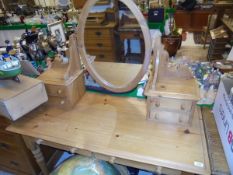 A modern pine dressing table with mirrored super structure raised on turned and ringed legs,