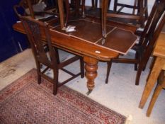 A 19th Century mahogany rectangular extending dining table with rounded corners,
