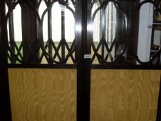 A three fold vanity screen with pierced and glazed top above Moire silk panels