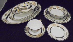 A "Kutani China" black and gilt decorated on white porcelain part dinner service