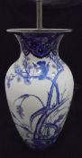 A Japanese blue and white vase as a table lamp with prunus blossom and bird decoration