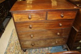A Victorian mahogany chest of two short over three long graduated drawers on turned feet