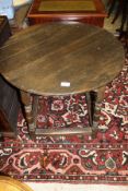 A 19th Century circular oak table,
