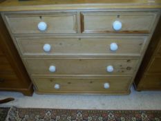 A Victorian pine chest of two short plus three long drawers with ceramic knob handles