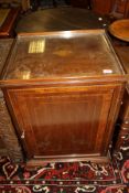 A 19th Century mahogany and satinwood inlaid pot cupboard with galleried top above a single door