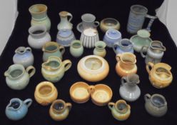 A large collection of Prinknash Pottery to include miniature jugs,