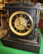 A late 19th Century French black slate and marble cased mantle clock,