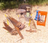 A collection of vintage garden tools to include two man saws, shovels, forks etc.