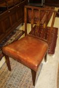 A set of twelve mahogany framed dining chairs with carved and pierced triple stick backs inlaid