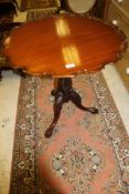 A modern mahogany tea table,