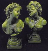A pair of Continental green glazed pottery figures of a Bacchus and Bacchanalian maiden,