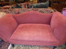 A terracotta upholstered drop-arm and back two seat sofa,