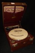 A Stonia gramophone in red leatherette case CONDITION REPORTS The white circle is a
