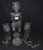 A carved ebonised figure of an African warrior,