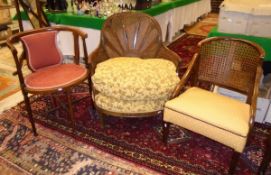 An early 20th Century mahogany Bergere framed armchair with yellow ground foliate seat,