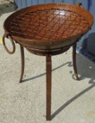 A firepit of small proportion on stand with grill*