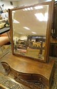 An Edwardian mahogany and inlaid toilet mirror with three drawers to base,