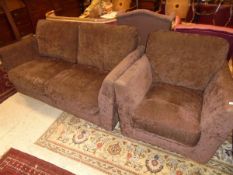 A modern two seat sofa and single armchair in chocolate brown upholstery
