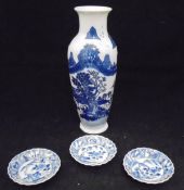 Three Chinese Kang Xi blue and white saucers and a Chinese blue and white vase with script marks