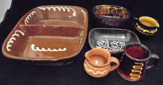 Eleven pieces of various modern slipware pottery, six Sarreguemines plates, six Limoges plates,