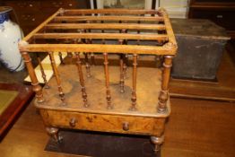 A Victorian walnut four section canterbury,