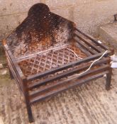 A cast iron fire basket and back