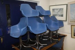 A set of ten Allibert chairs with blue plastic bucket seats on splayed chrome pedestals