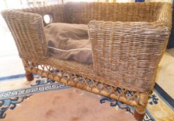 An Oka wicker dog bed CONDITION REPORTS Approx 79 cm long x 61 cm deep x 42 cm high.