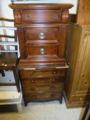 A modern mahogany bedside cupboard together with a 19th Century mahogany square front chest of four