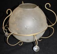 A frosted and star cut decorated ceiling light shade of ovoid form,