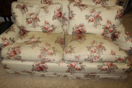 An upholstered three seat sofa in Colefax & Fowler style fabric
