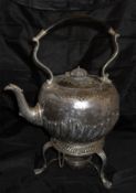 A silver spirit kettle on stand with ebony handle and ovoid body with stylised reeded decoration,