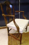 A 19th century Hepplewhite style elbow chair with upholstered seat