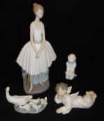 A Nao figurine of ballet dancer, a Lladro figural group of swan and ducklings,