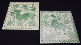 Two Jiacomo Alessi Sicilian tiles in the medieval style, one depicting a rabbit, the other a bird,
