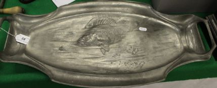 An Art Nouveau pewter fish platter with embossed decoration in the manner of Kayserzinn