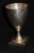 A George III silver goblet of plain form, raised on a square base (by Peter and Anne Bateman,
