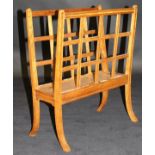 A 19th Century satin walnut and inlaid magazine rack, the top of lattice form above swept legs, 50.