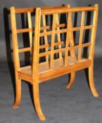 A 19th Century satin walnut and inlaid magazine rack, the top of lattice form above swept legs, 50.