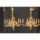 A pair of decorative six branch electroliers with gilt decoration in the Rococo manner with